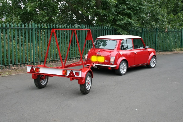 Advertisement Sign Trailer Pulled By Mini Cooper