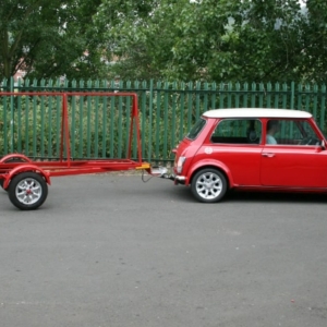 Advertisement Sign Trailer Pulled By Red Mini Cooper