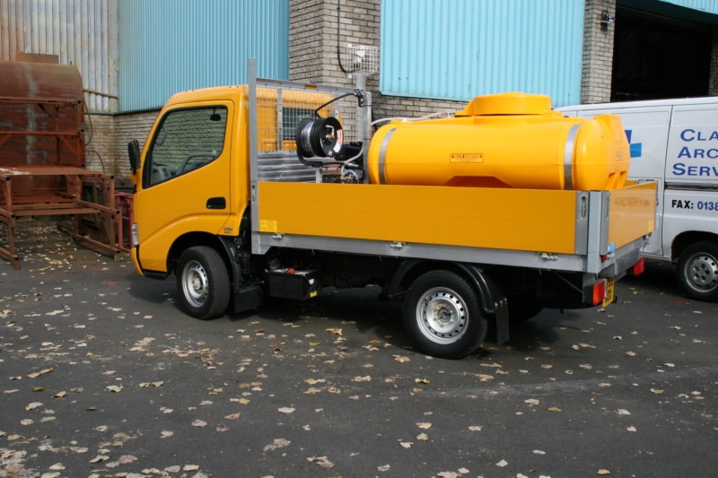 toyota truck with water bowser and pressure washer mounted to the back