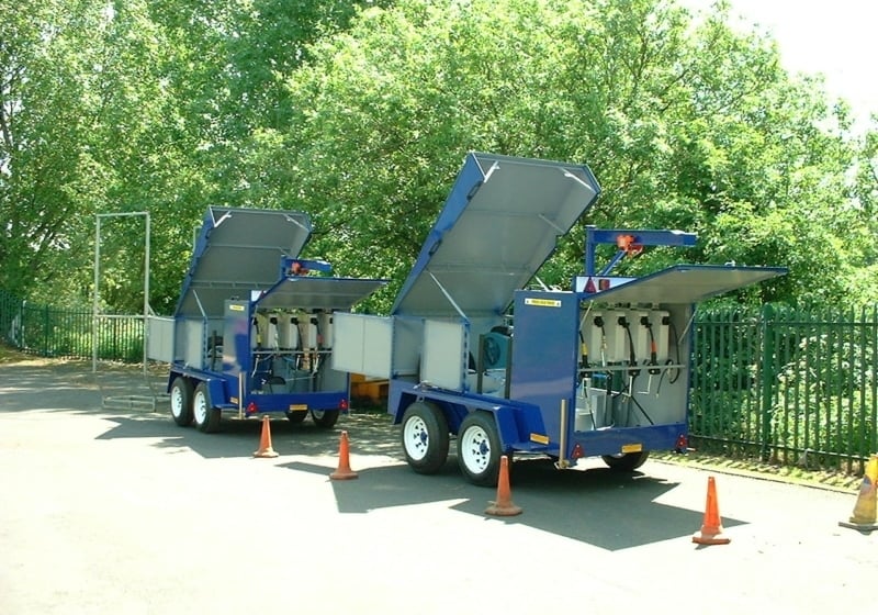 Two blue Jcb Lube Trailers